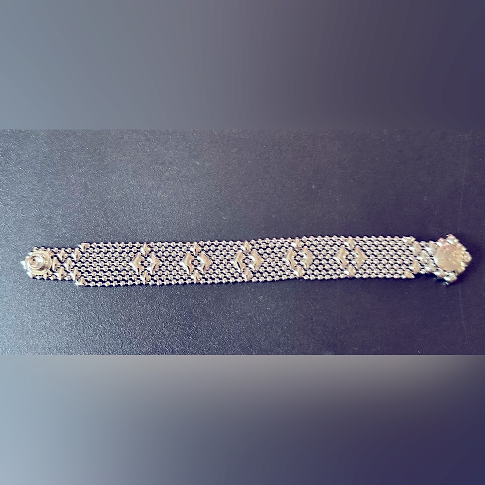 SG Liquid Metal by Sergio
Gutierrez Small Flower
Silver Mesh Cuff Bracelet